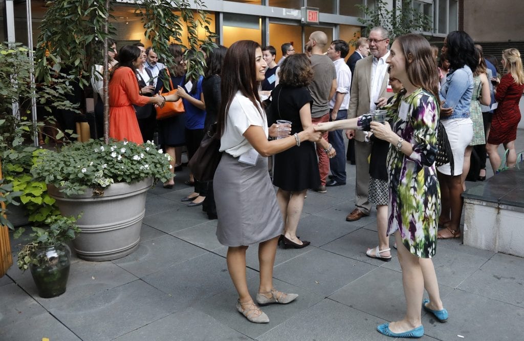 two women meeting at a previous AMA New York event