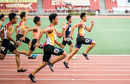 runners race towards a finish line we cannot see